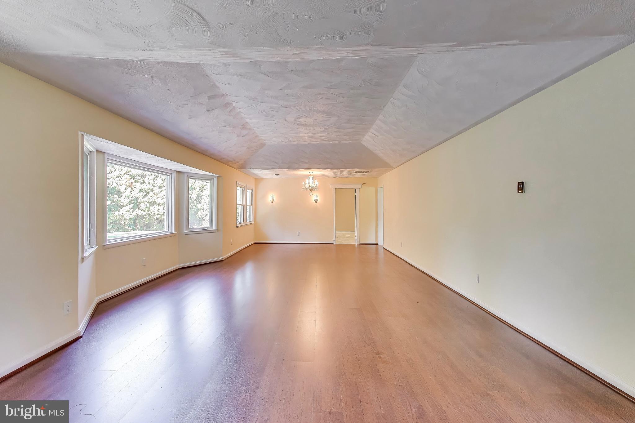 402 Ivy Church Road Lutherville-Timonium, MD 21093 - Photo 28 of 63 wooden floor in an empty room with a window