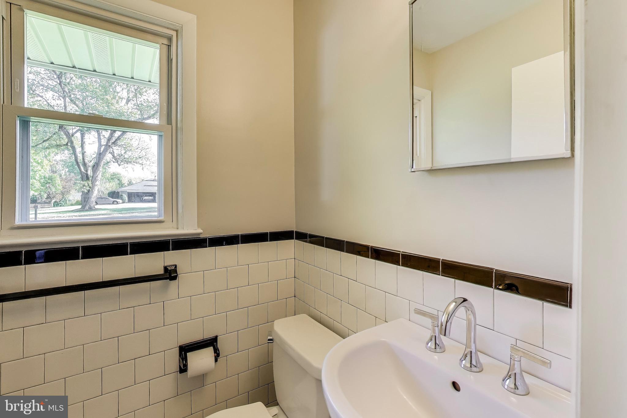 402 Ivy Church Road Lutherville-Timonium, MD 21093 - Photo 36 of 63 a bathroom with a sink and a window