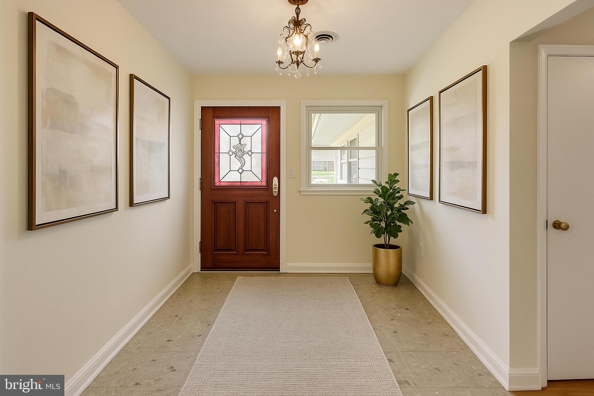 402 Ivy Church Road Lutherville-Timonium, MD 21093 - Photo 52 of 63 a view of an entryway with wooden floor and front door