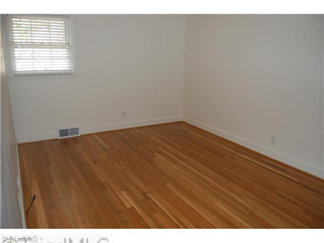691 Chester Road Winston-Salem, NC 27104 - Photo 12 of 16 4th Bedroom. Bedroom with refinished hardwood flooring.