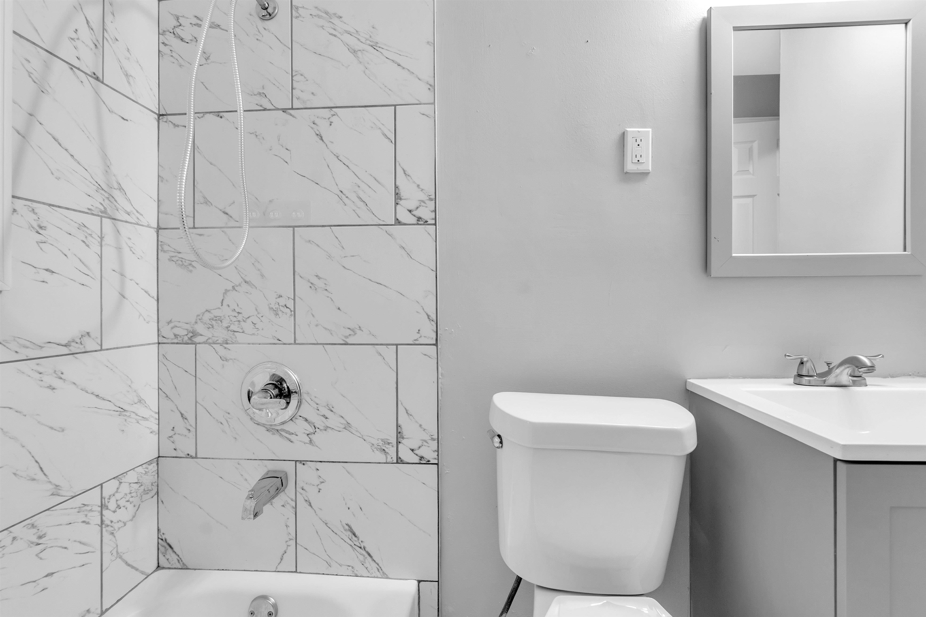 1136 South White Station Road Memphis, TN 38117 - Photo 16 of 19 a bathroom with a sink a toilet and mirror