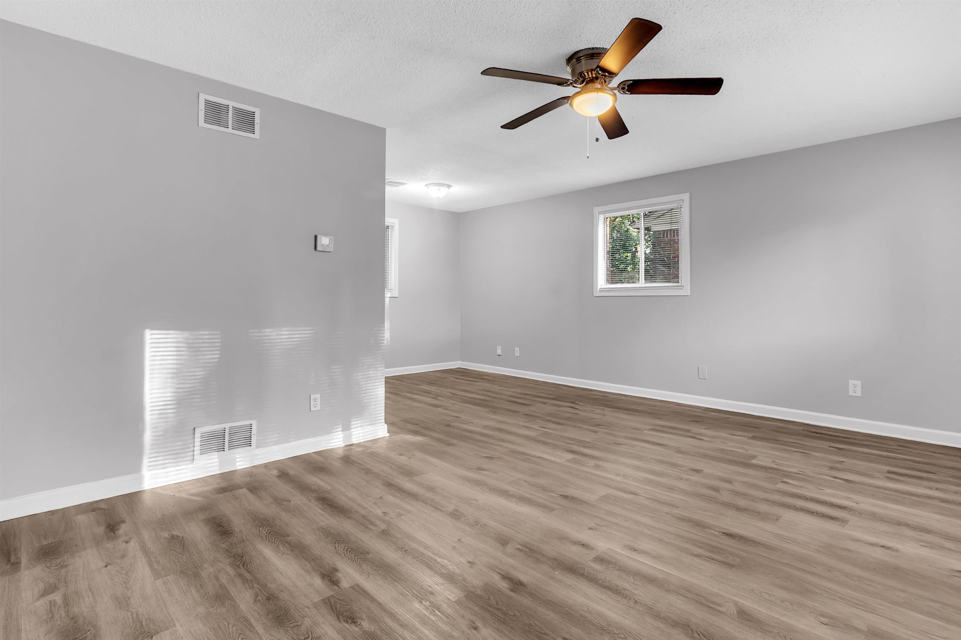 1136 South White Station Road Memphis, TN 38117 - Photo 8 of 19 a view of empty room with wooden floor