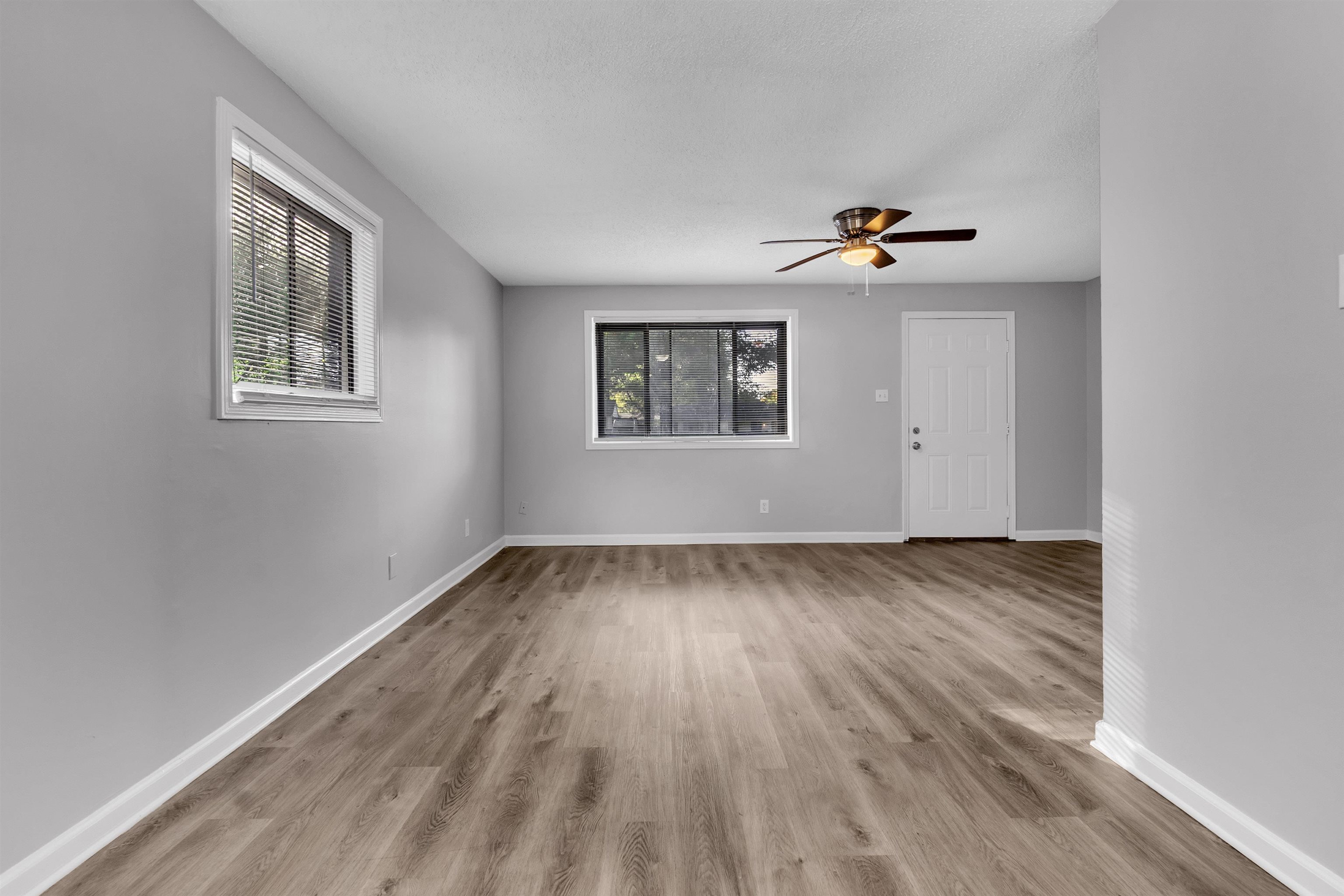 1136 South White Station Road Memphis, TN 38117 - Photo 9 of 19 wooden floor in an empty room with a window