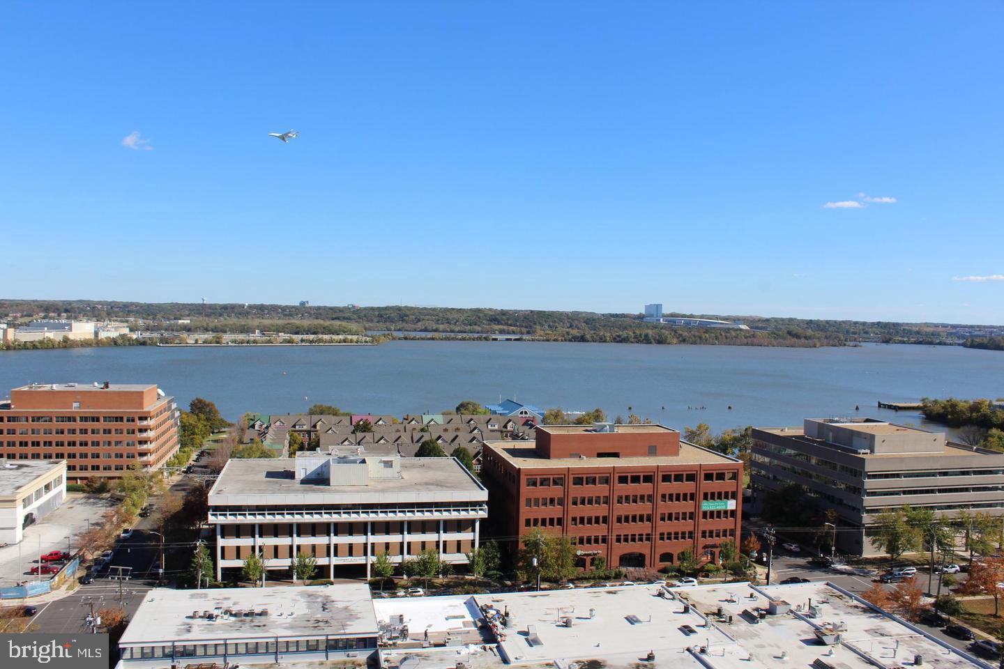 801 North Pitt Street, Unit 1206 Alexandria, VA 22314 - Photo 18 of 37 a view of a lake with building in front of it