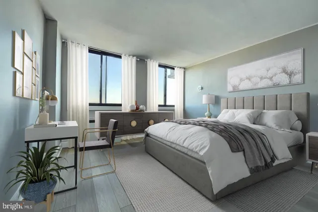 a bedroom with a bed a mirror and a window