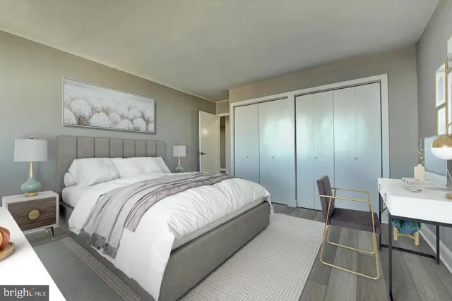 a bedroom with a bed and a table in it