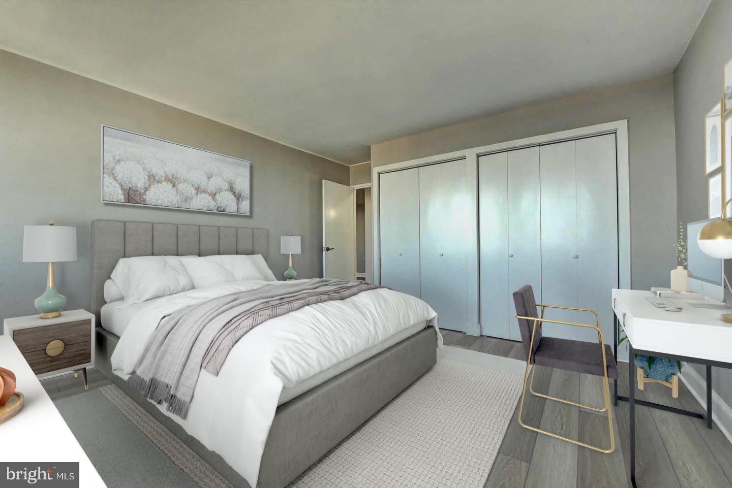 801 North Pitt Street, Unit 1206 Alexandria, VA 22314 - Photo 21 of 37 a bedroom with a bed and a table in it