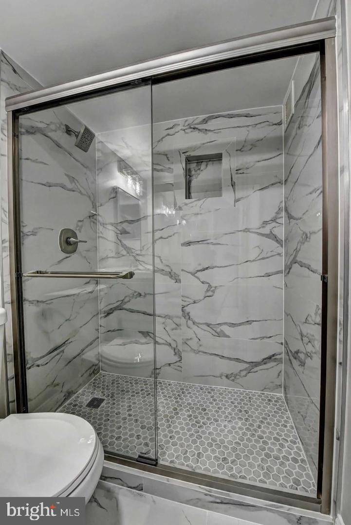 801 North Pitt Street, Unit 1206 Alexandria, VA 22314 - Photo 26 of 37 a bathroom with a toilet and a shower