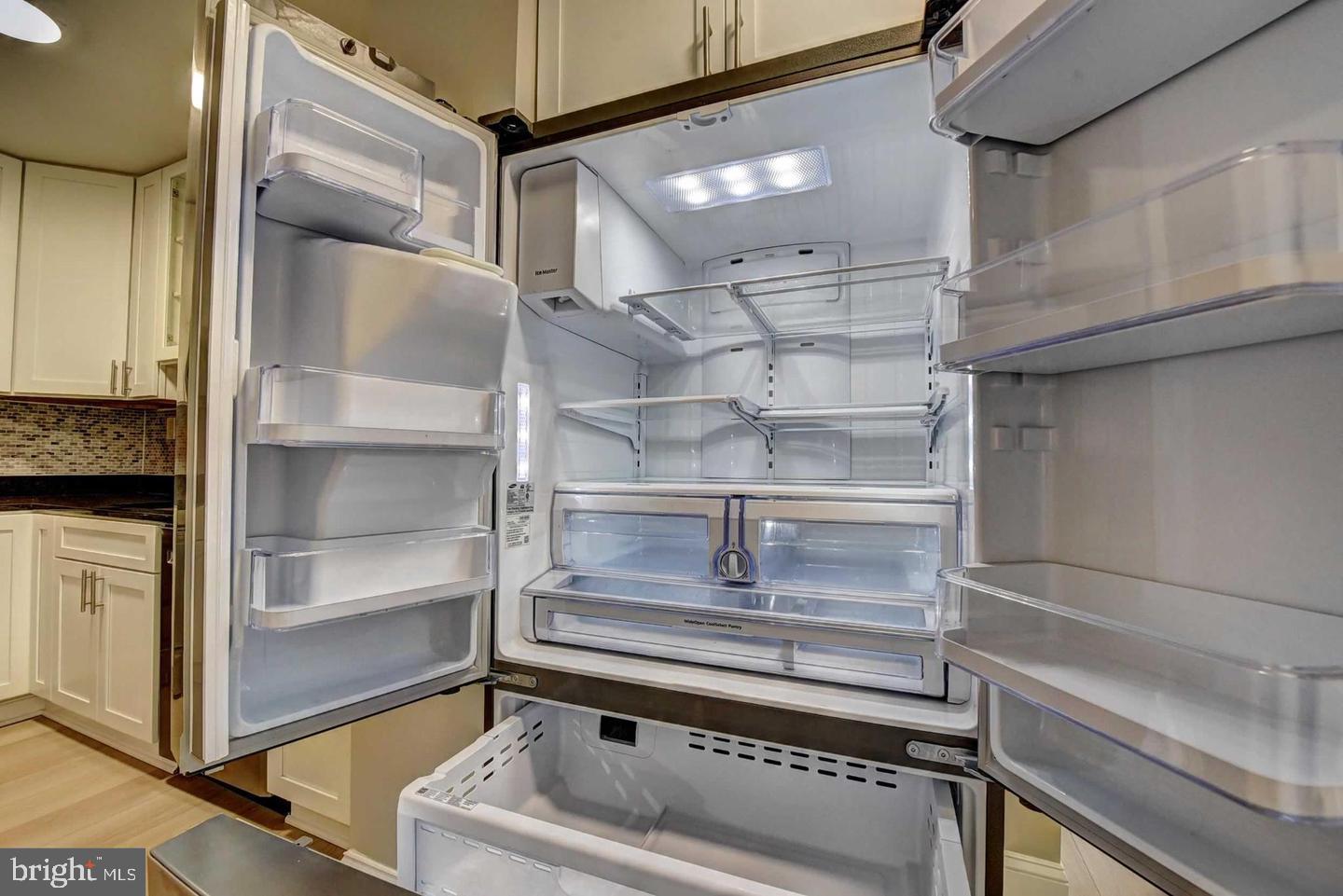 801 North Pitt Street, Unit 1206 Alexandria, VA 22314 - Photo 10 of 37 a refrigerator in a kitchen