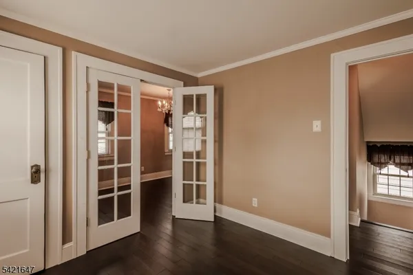 a view of wooden floor and windows in a room