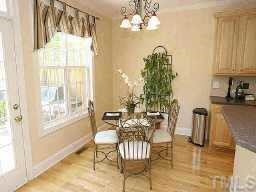 7264 Summit Waters Lane Raleigh, NC 27613 - Photo 5 of 9 Breakfast nook has lots of natural light beaming thur and has a large exterior deck, just a few steps away.