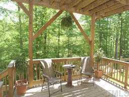 7264 Summit Waters Lane Raleigh, NC 27613 - Photo 9 of 9 Lower deck is very large and can have steps built down to a fenced area, should you have children or pets that need a secured place to play! What a great view of the greenway and very seclued!