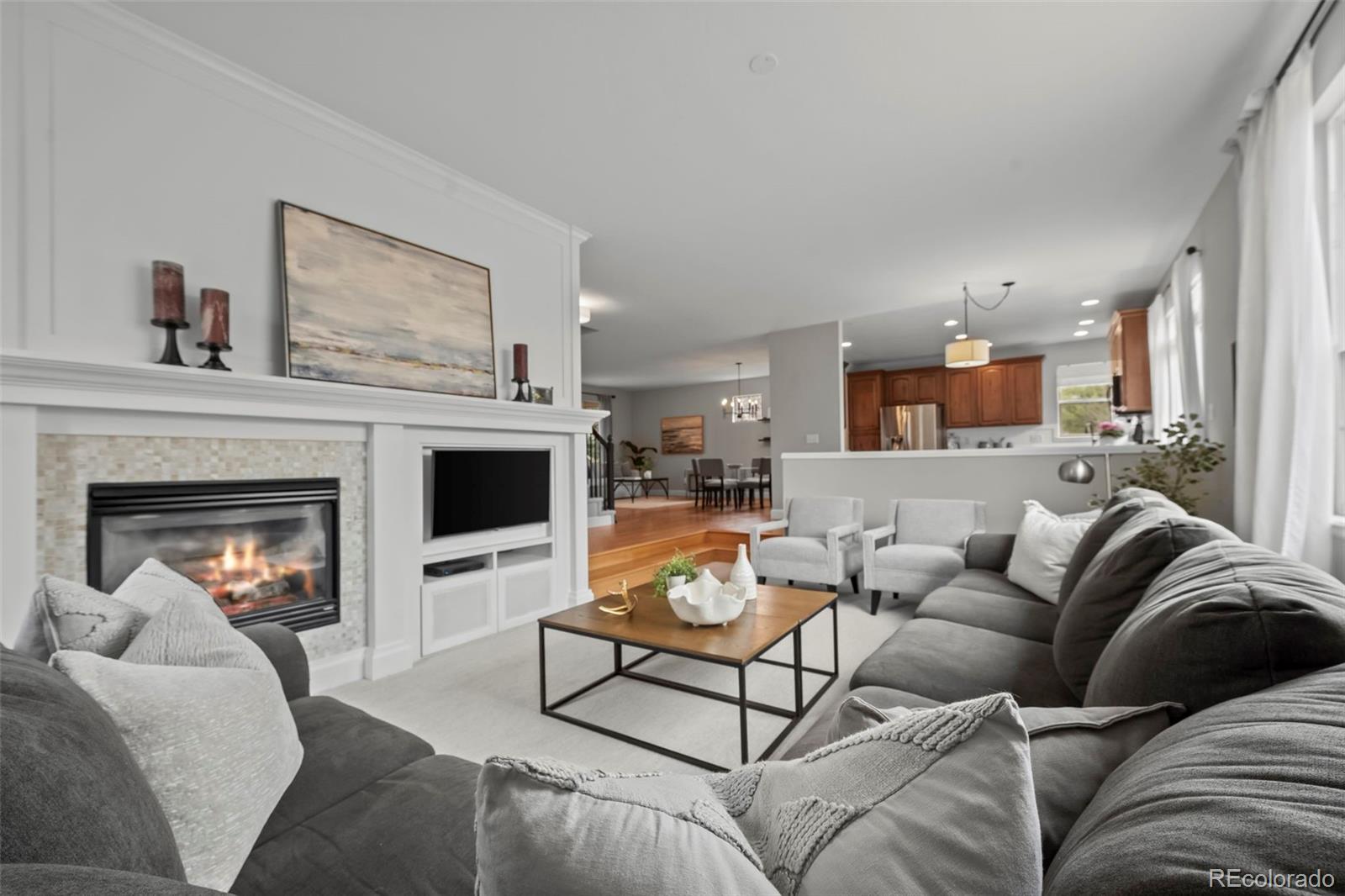 4463 Eagle River Run Broomfield, CO 80023 - Photo 20 of 44 a living room with furniture and a fireplace