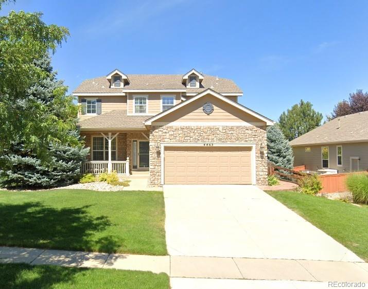 4463 Eagle River Run Broomfield, CO 80023 - Photo 2 of 44 a front view of a house with garden