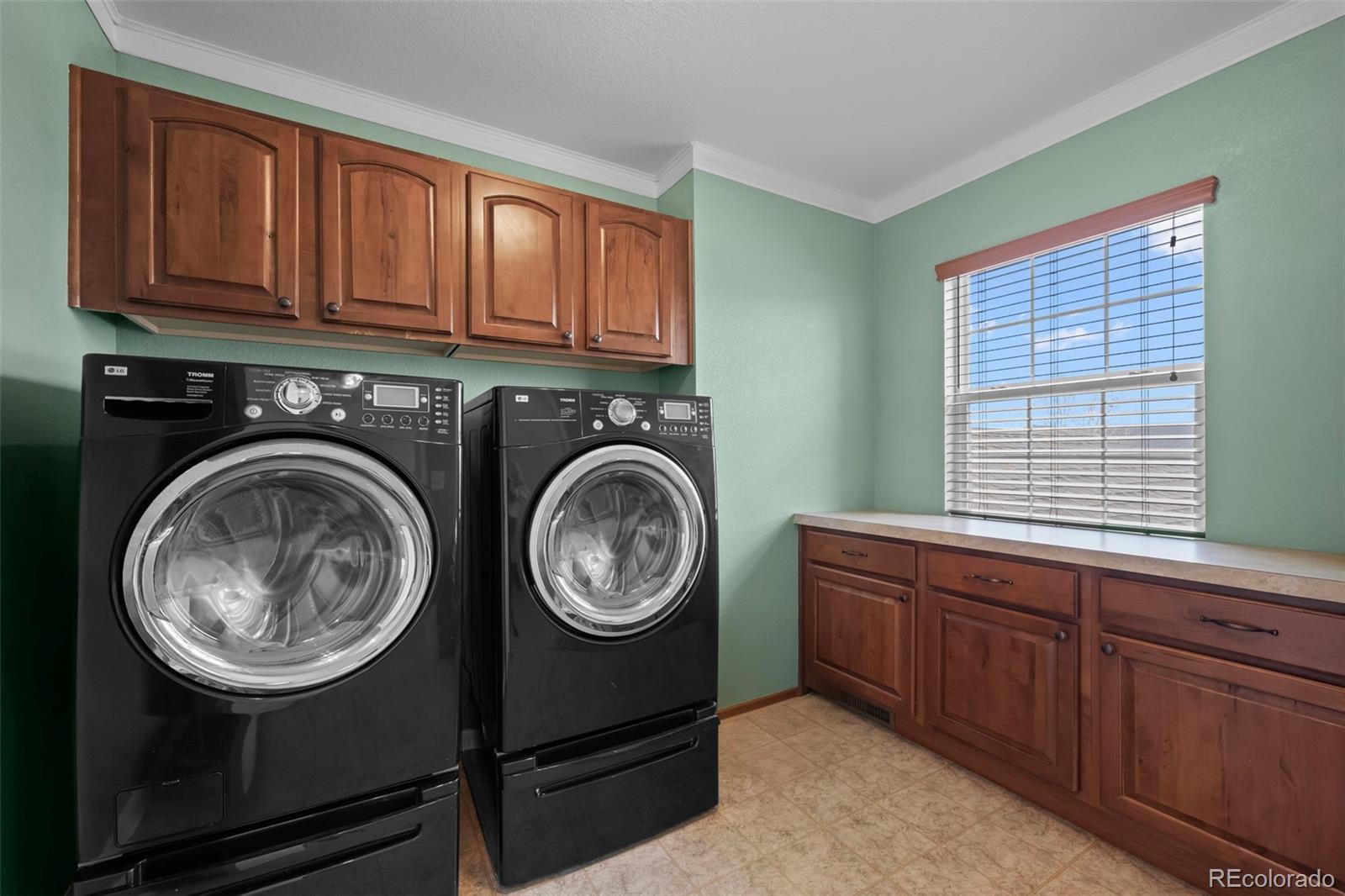 4463 Eagle River Run Broomfield, CO 80023 - Photo 22 of 44 a view of a storage and utility room with washer and dryer