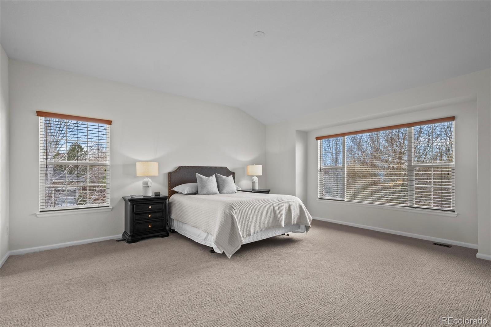 4463 Eagle River Run Broomfield, CO 80023 - Photo 23 of 44 a bed room with a bed and a chair
