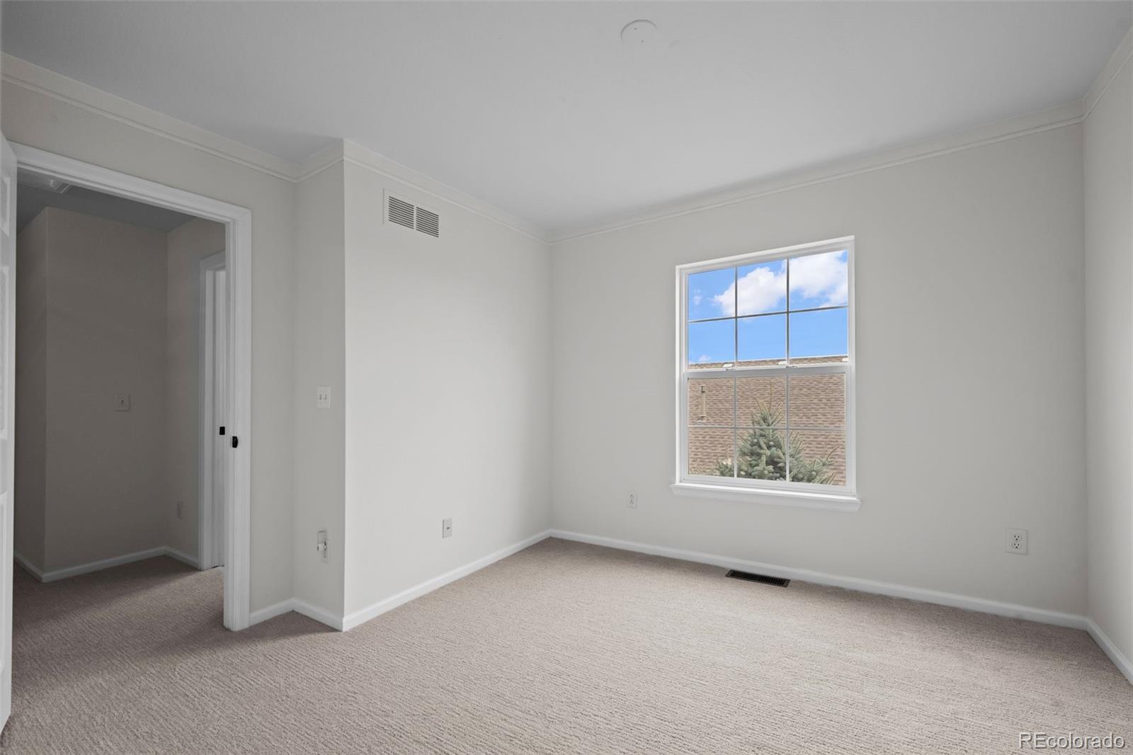 4463 Eagle River Run Broomfield, CO 80023 - Photo 28 of 44 an empty room with windows