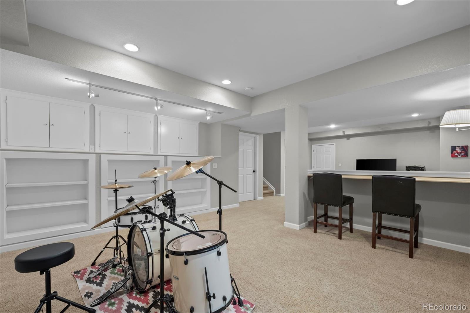 4463 Eagle River Run Broomfield, CO 80023 - Photo 32 of 44 a view of a room with gym equipment