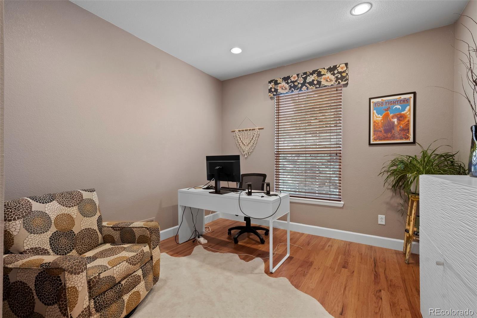 4463 Eagle River Run Broomfield, CO 80023 - Photo 5 of 44 a workspace with furniture and a window