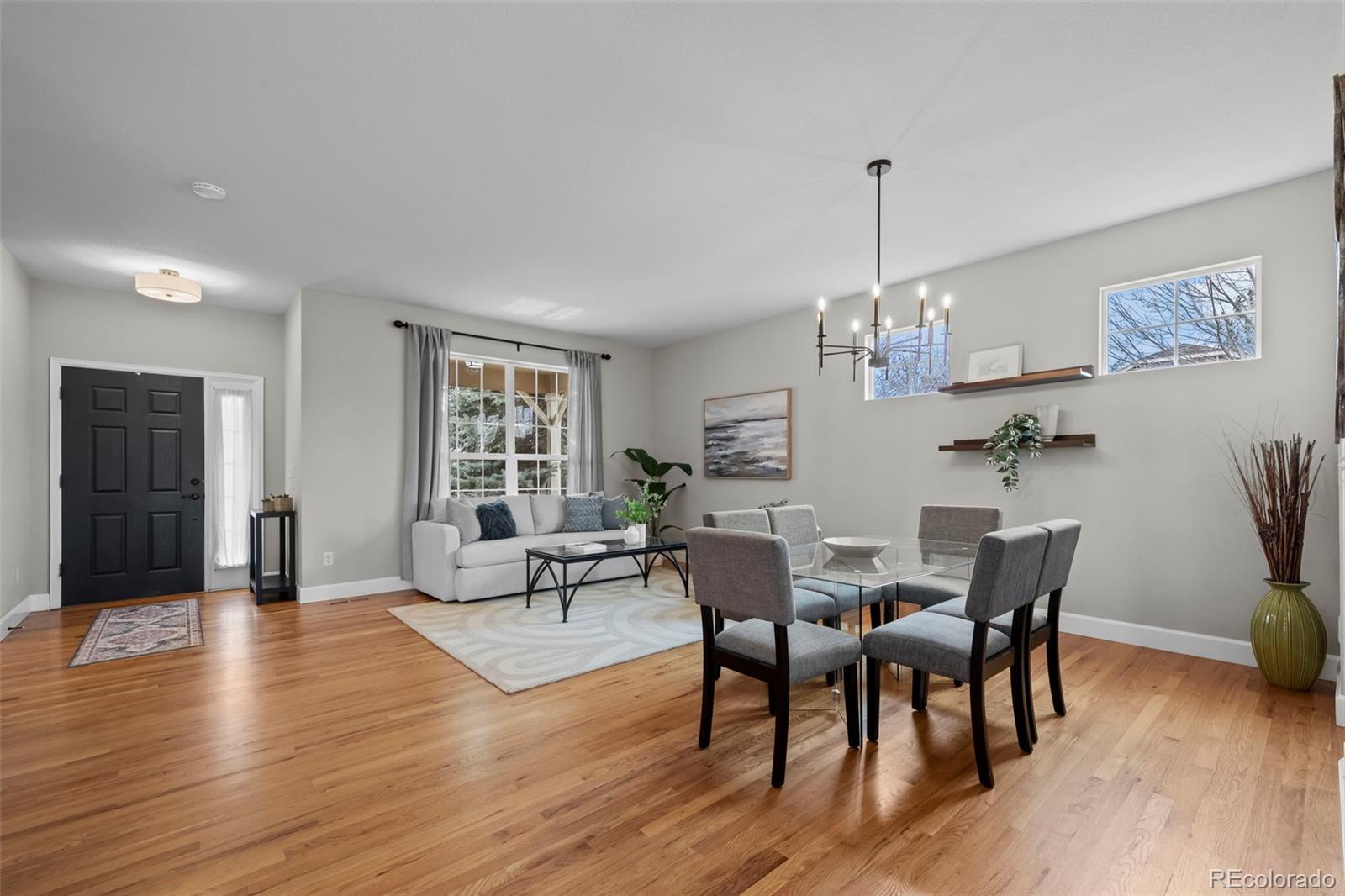 4463 Eagle River Run Broomfield, CO 80023 - Photo 6 of 44 a view of a dining room with furniture window and wooden floor