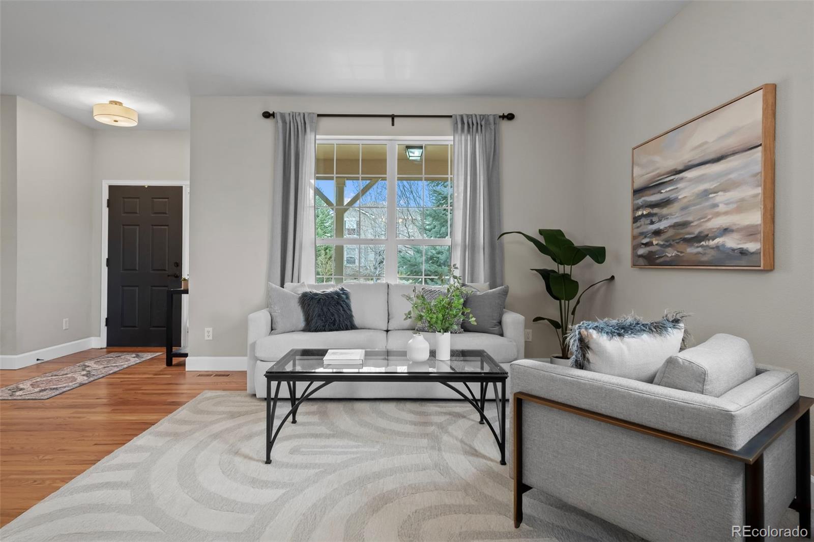 4463 Eagle River Run Broomfield, CO 80023 - Photo 8 of 44 a living room with furniture and a window
