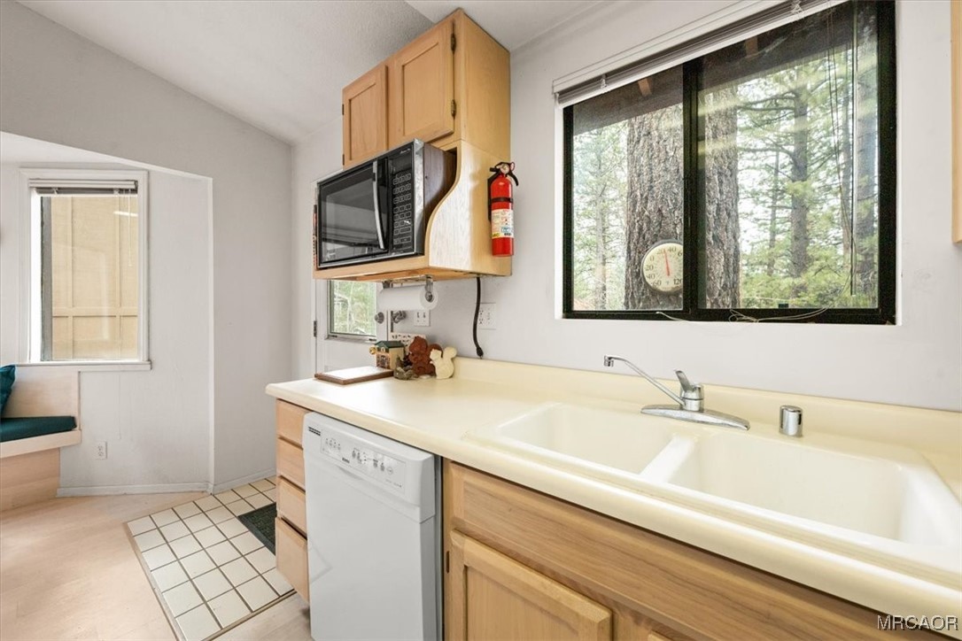 148 Crystal Lake Road Big Bear Lake, CA 92315 - Photo 13 of 29 a bathroom with a sink and a mirror