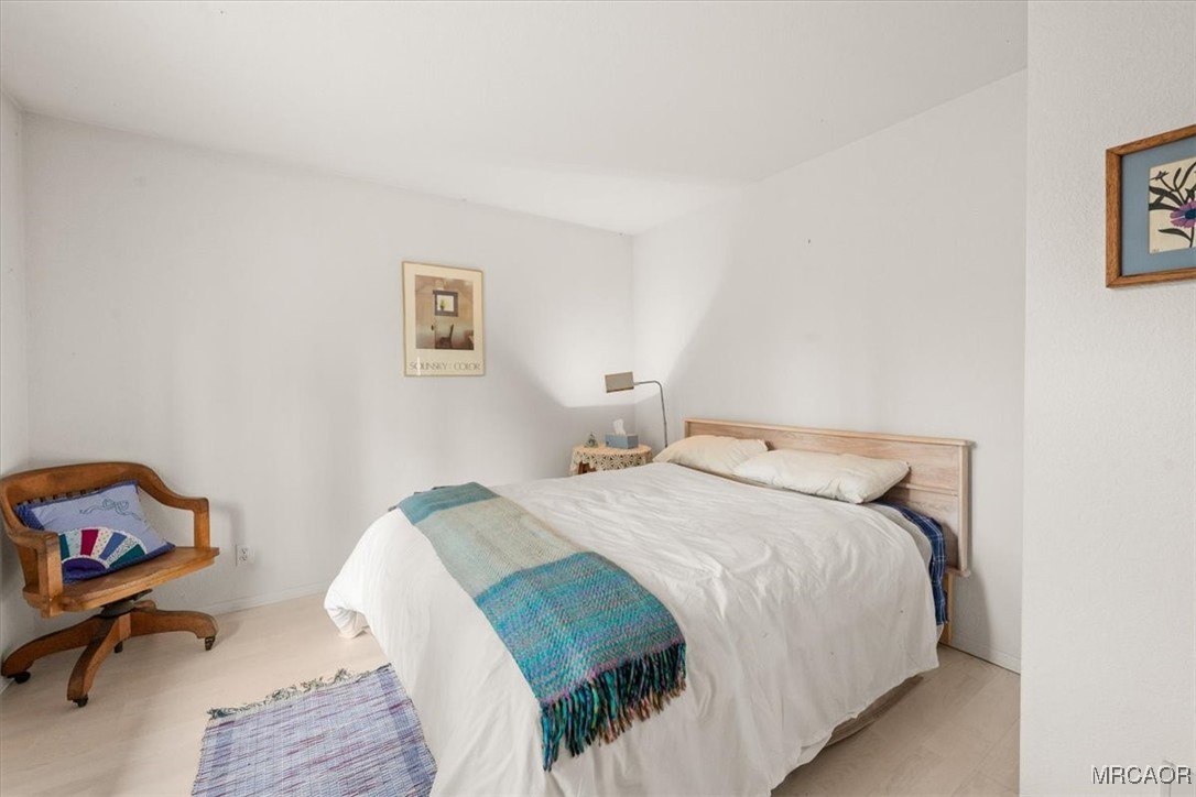 148 Crystal Lake Road Big Bear Lake, CA 92315 - Photo 17 of 29 a bedroom with a bed and a desk