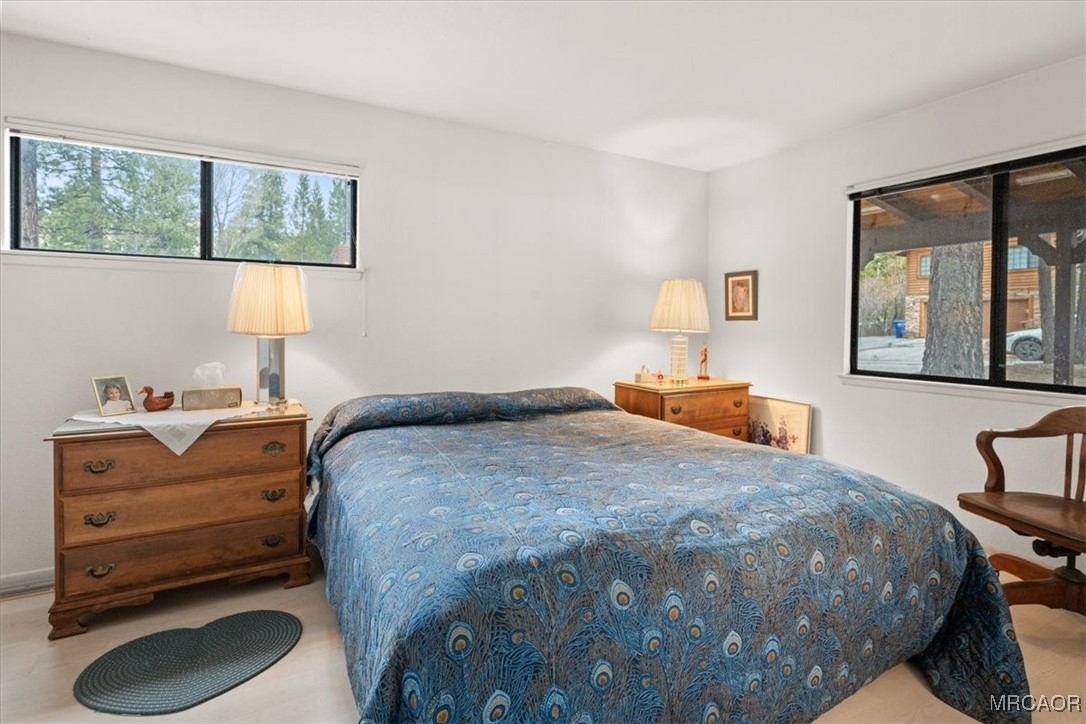 148 Crystal Lake Road Big Bear Lake, CA 92315 - Photo 19 of 29 a bedroom with a bed and window