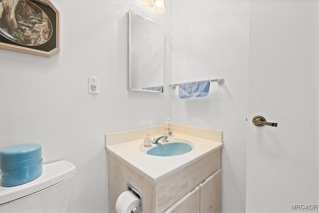 148 Crystal Lake Road Big Bear Lake, CA 92315 - Photo 24 of 29 a bathroom with a sink and a mirror