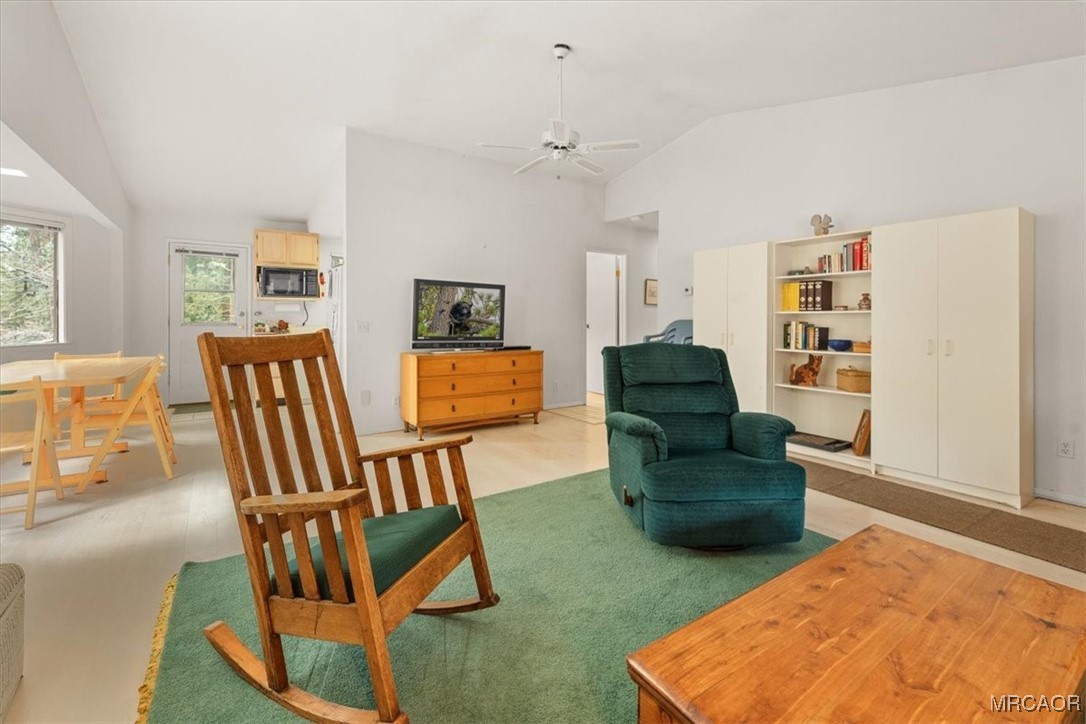 148 Crystal Lake Road Big Bear Lake, CA 92315 - Photo 8 of 29 a living room with furniture and a wooden floor