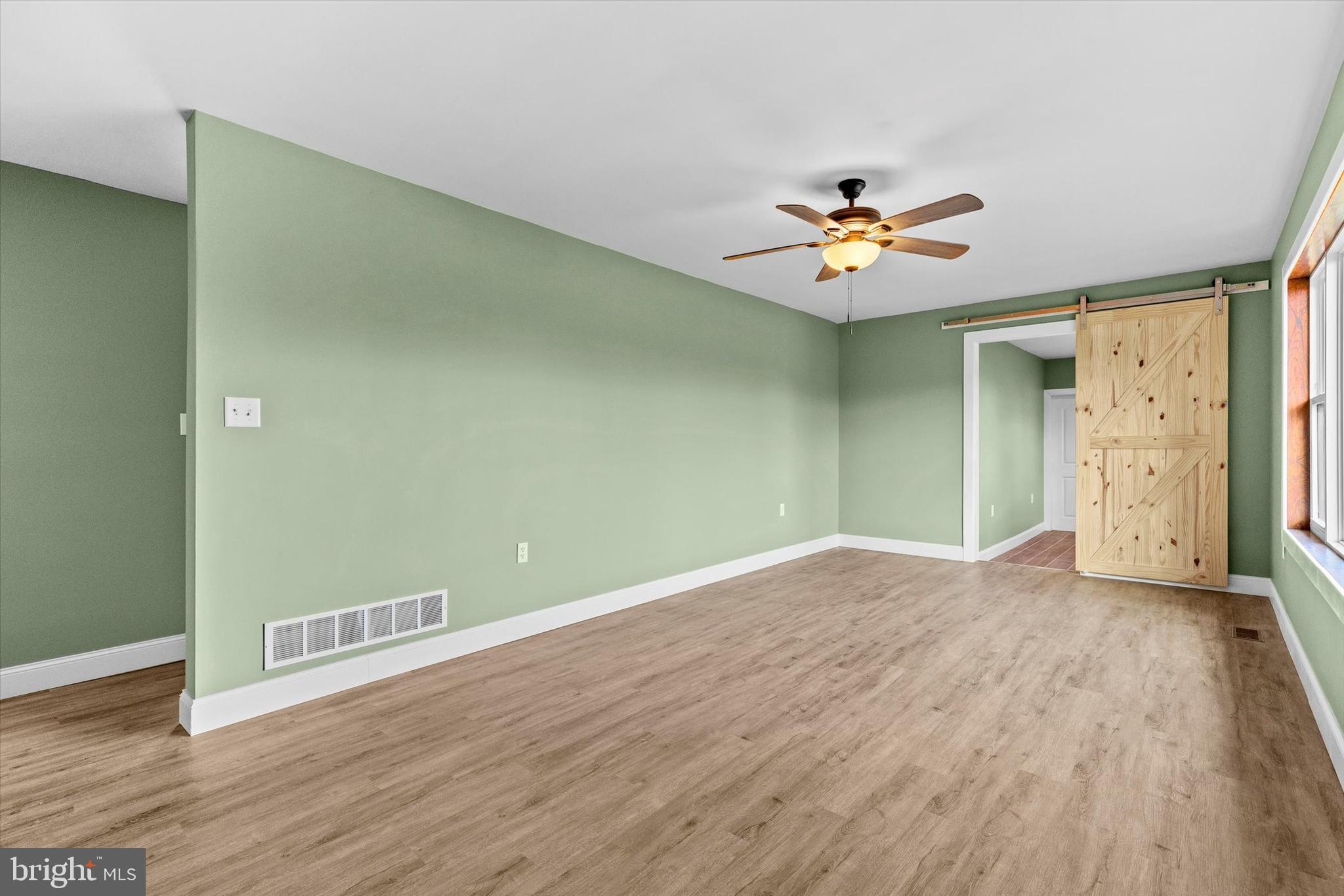 1228 Matamoras Road Halifax, PA 17032 - Photo 7 of 45 wooden floor in an empty room with a window