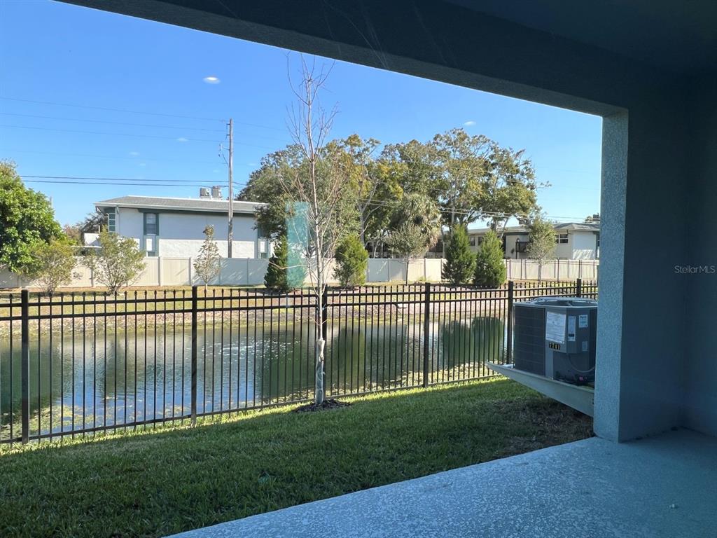 7741 93rd Street North Seminole, FL 33777 - Photo 11 of 11 a view of a house with a small yard and a garden