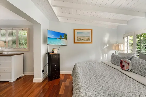 a bathroom with a sink a mirror and a shower