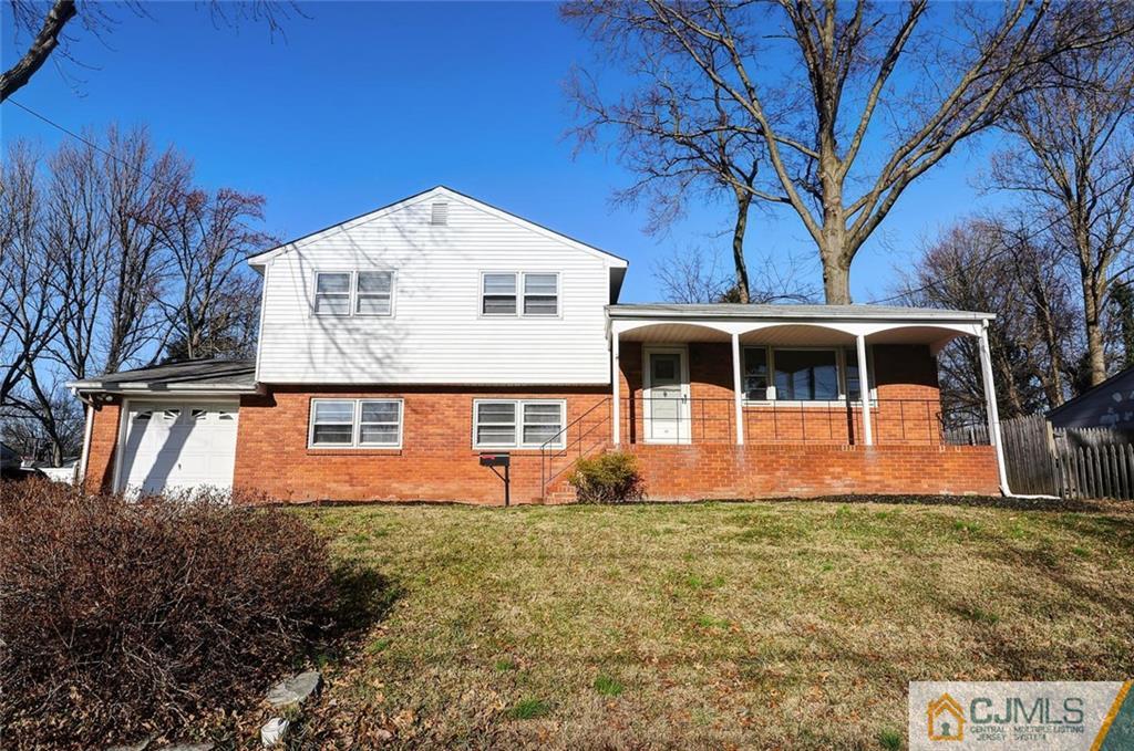 20 Barnett Road Lawrence Township, NJ 08648 - Photo 1 of 27 a front view of a house with garden