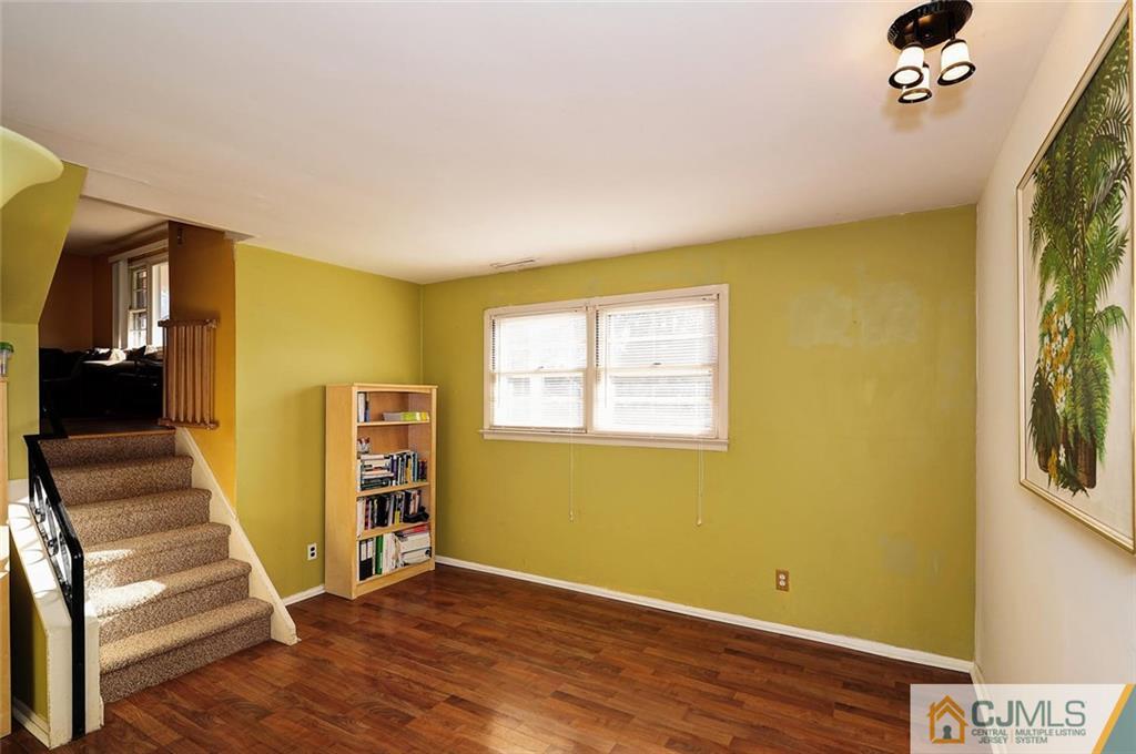 20 Barnett Road Lawrence Township, NJ 08648 - Photo 13 of 27 a view of an empty room with wooden floor and a window
