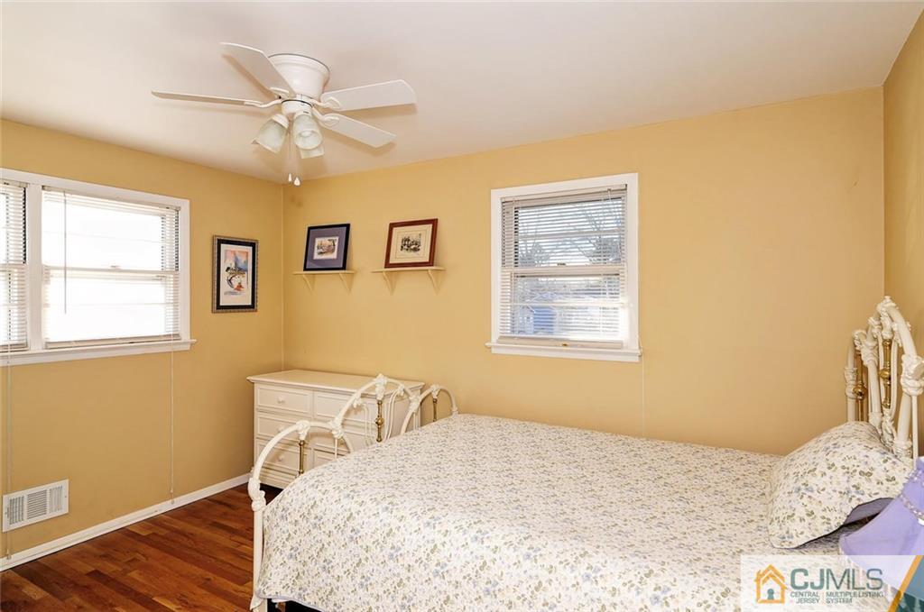 20 Barnett Road Lawrence Township, NJ 08648 - Photo 15 of 27 a bedroom with a bed and a window