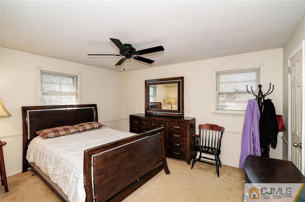 20 Barnett Road Lawrence Township, NJ 08648 - Photo 16 of 27 a bedroom with a bed and a television
