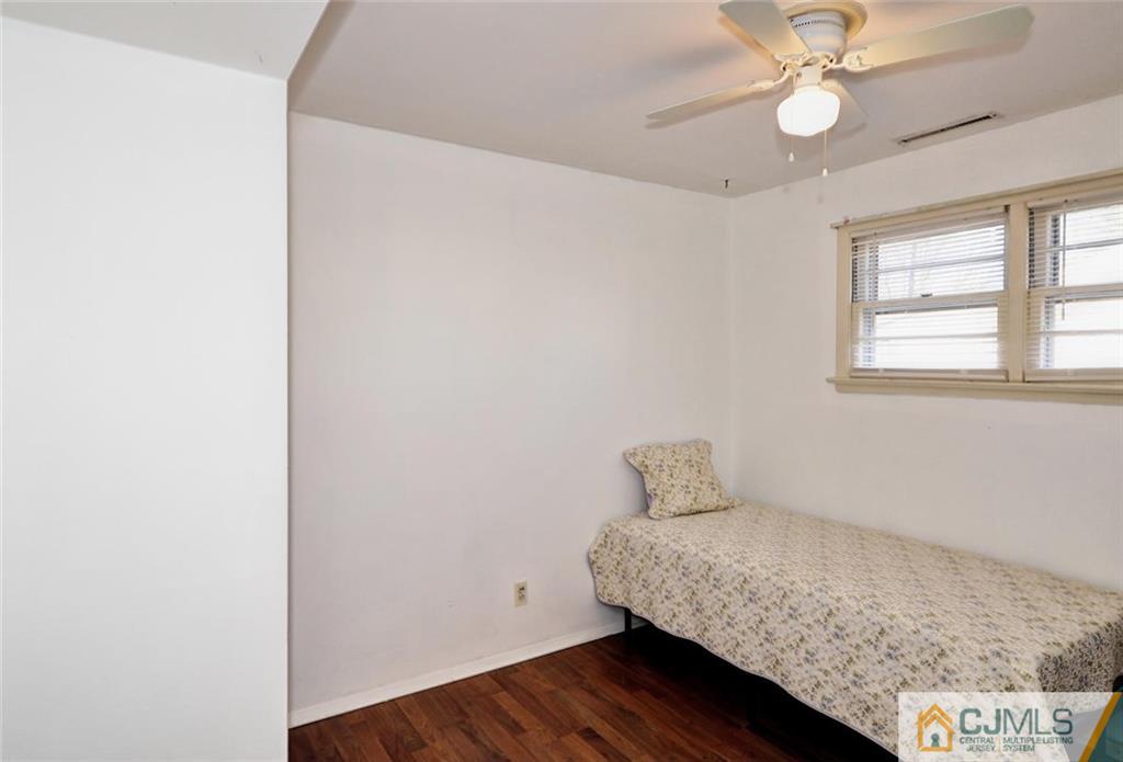 20 Barnett Road Lawrence Township, NJ 08648 - Photo 17 of 27 a bedroom with a bed and a window