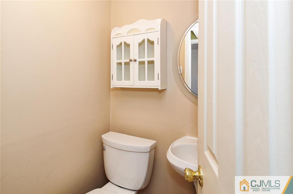 20 Barnett Road Lawrence Township, NJ 08648 - Photo 20 of 27 a bathroom with a toilet and a sink