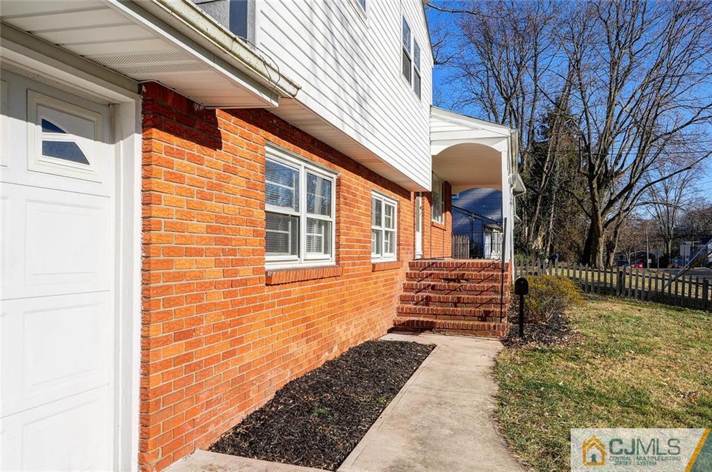 20 Barnett Road Lawrence Township, NJ 08648 - Photo 3 of 27 a front view of a house with a yard