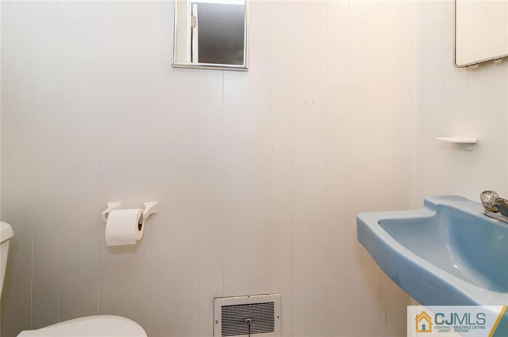 20 Barnett Road Lawrence Township, NJ 08648 - Photo 21 of 27 a bathroom with a sink and a toilet