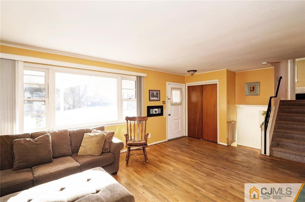 20 Barnett Road Lawrence Township, NJ 08648 - Photo 7 of 27 a living room with furniture and a large window
