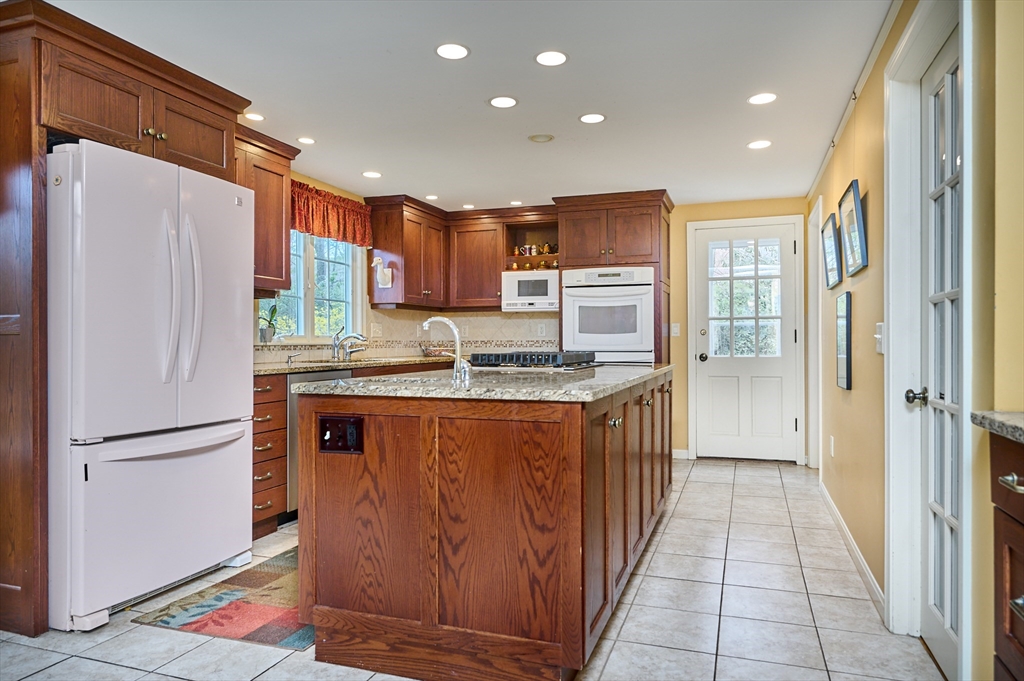 33 Echo Hill Road Amherst, MA 01002 - Photo 11 of 37 a kitchen with stainless steel appliances granite countertop a refrigerator and a sink