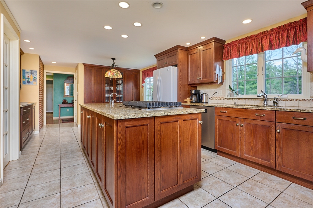 33 Echo Hill Road Amherst, MA 01002 - Photo 12 of 37 a kitchen with stainless steel appliances granite countertop a stove a sink dishwasher and a refrigerator