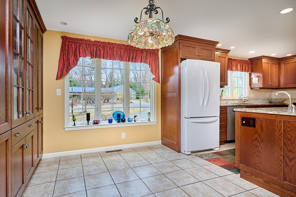 33 Echo Hill Road Amherst, MA 01002 - Photo 16 of 37 a kitchen with stainless steel appliances granite countertop a refrigerator and a sink