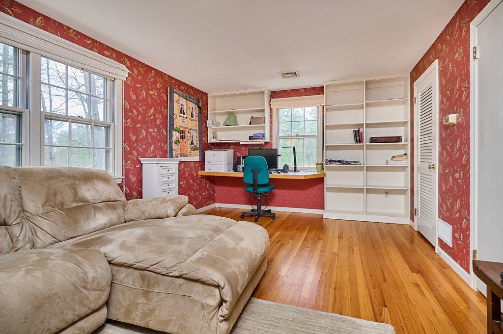 33 Echo Hill Road Amherst, MA 01002 - Photo 19 of 37 a living room with furniture and a fireplace