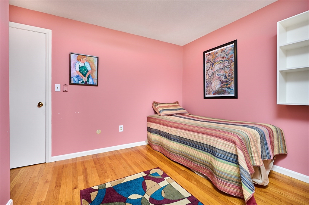 33 Echo Hill Road Amherst, MA 01002 - Photo 21 of 37 a bedroom with a bed and a painting on the wall