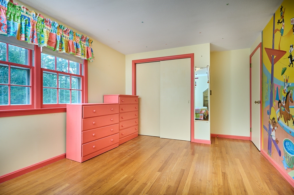 33 Echo Hill Road Amherst, MA 01002 - Photo 23 of 37 a room with wooden floor and a book shelf