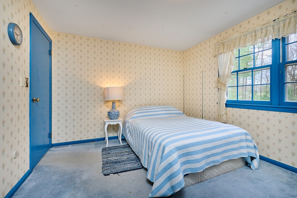 33 Echo Hill Road Amherst, MA 01002 - Photo 27 of 37 a bedroom with a bed and a window