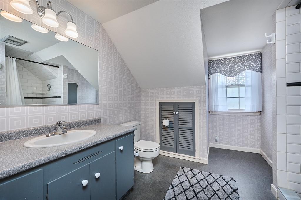 33 Echo Hill Road Amherst, MA 01002 - Photo 28 of 37 a bathroom with a granite countertop sink a toilet and a mirror